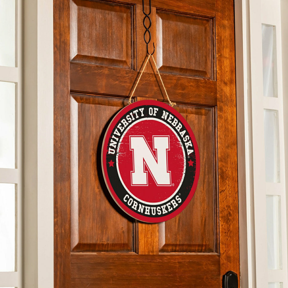University of Nebraska Round Door Décor with Hanging Rope, 18x18 - Collegiate Home
