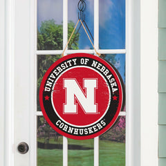 University of Nebraska Round Door Décor with Hanging Rope, 18x18 - Collegiate Home